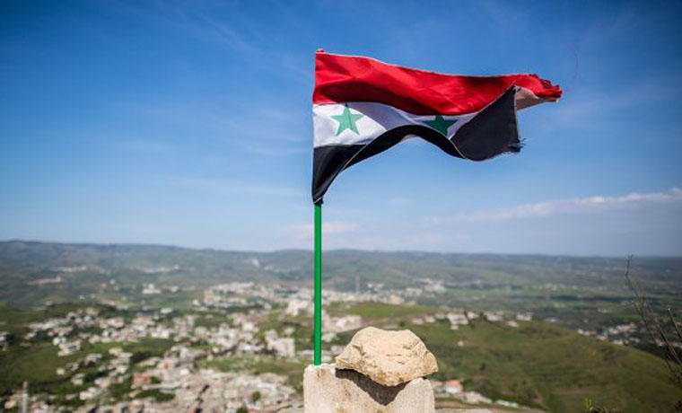 Государственный флаг Сирии подняли в центре Пальмиры